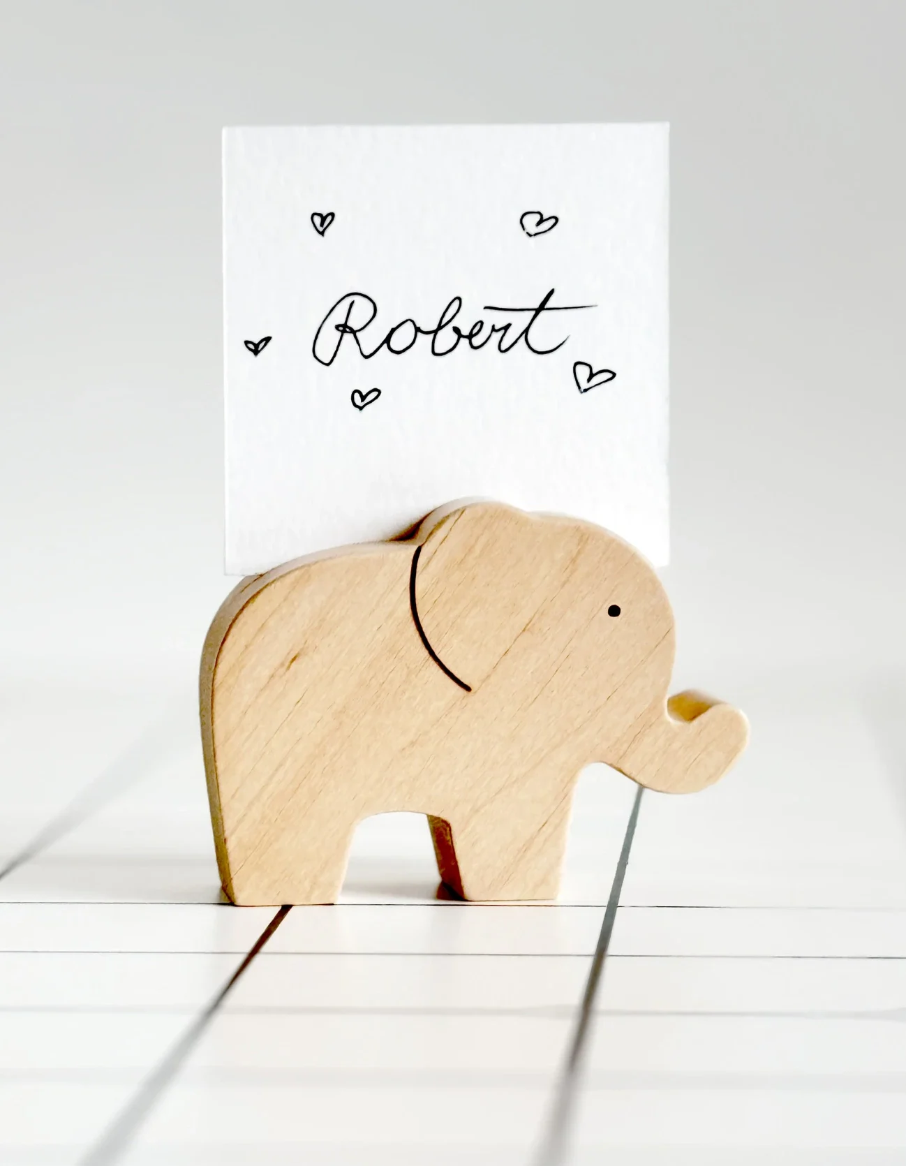 Stalo kortelių, vardų, priminimų ar kitų svarbių popierinių dalykėlių laikikliai